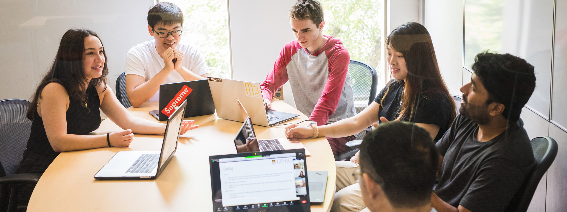 A group of students work on a data driven project